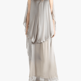 Silver dress worn by a person, showing the loose fit.