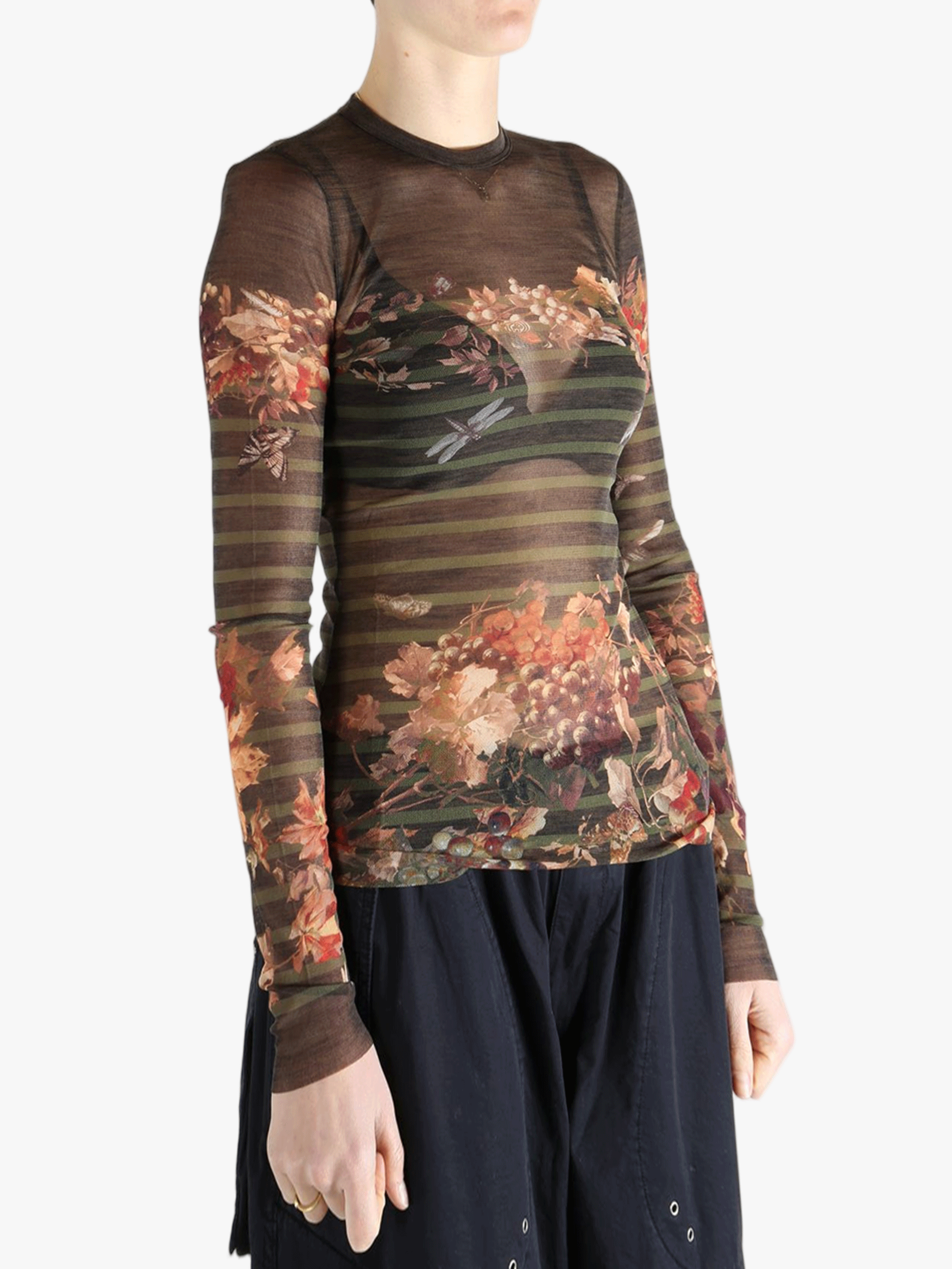 Brown top worn by a person, showing the top's fit