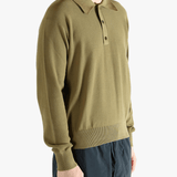 Green sweater worn by a person, showing the sweater fit