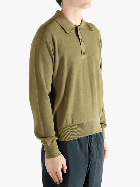 Green sweater worn by a person, showing the sweater fit