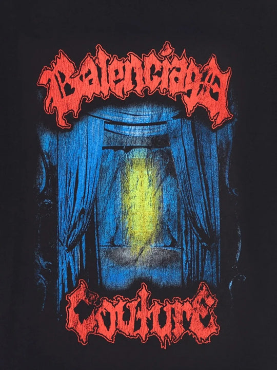 Close up of black t-shirts, showing texture of the cotton fabric