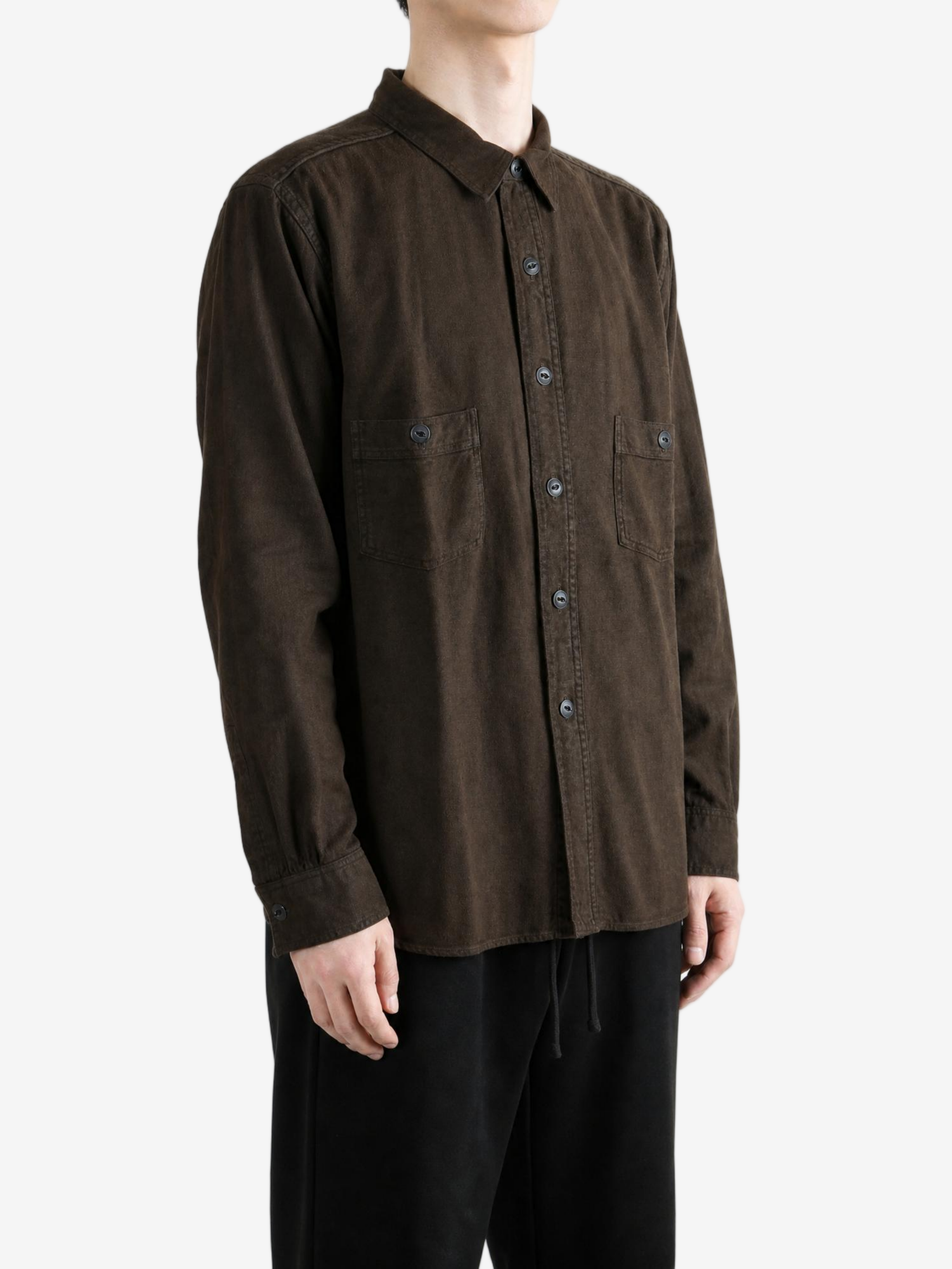 Brown shirt worn by a person, showing the shirt fit