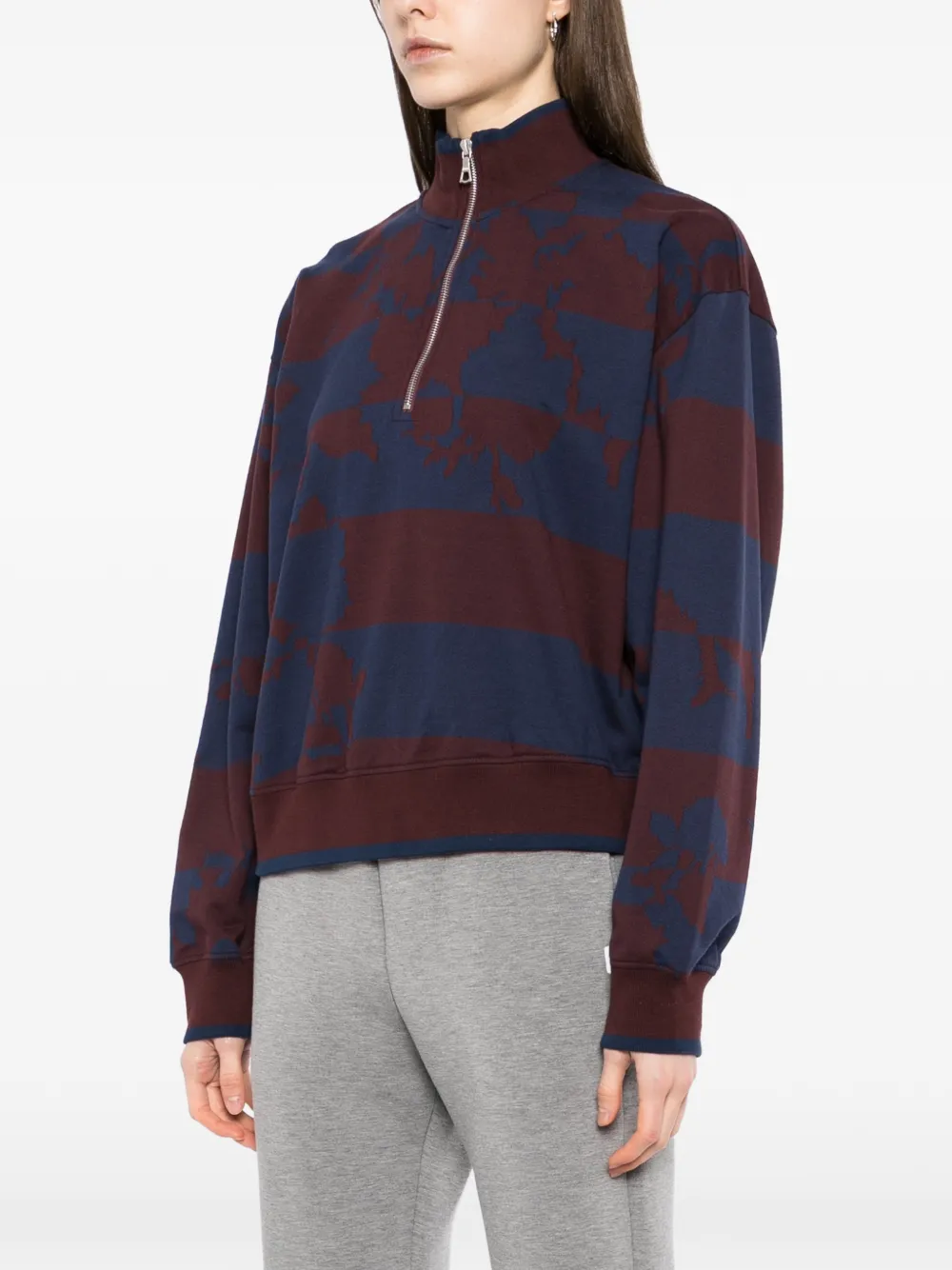 Burgundy sweater,worn by a person, showing the sweater's fit