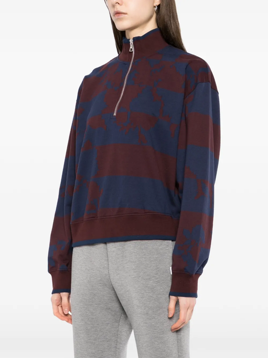 Burgundy sweater,worn by a person, showing the sweater's fit