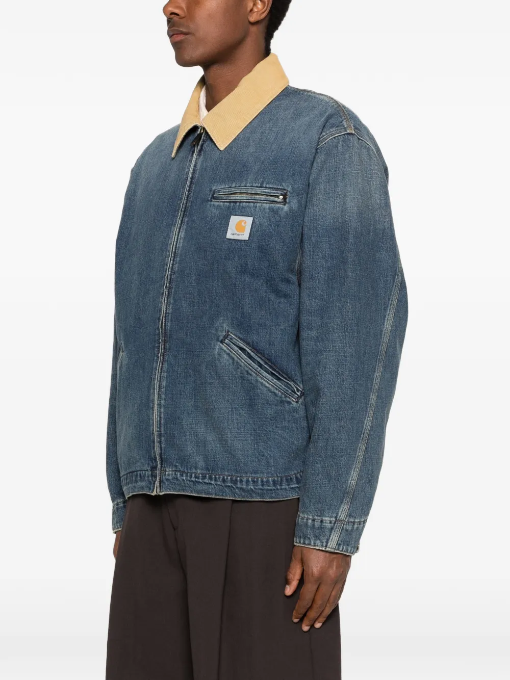 Blue jackets-coats, worn by a person, showing the jackets-coats fit