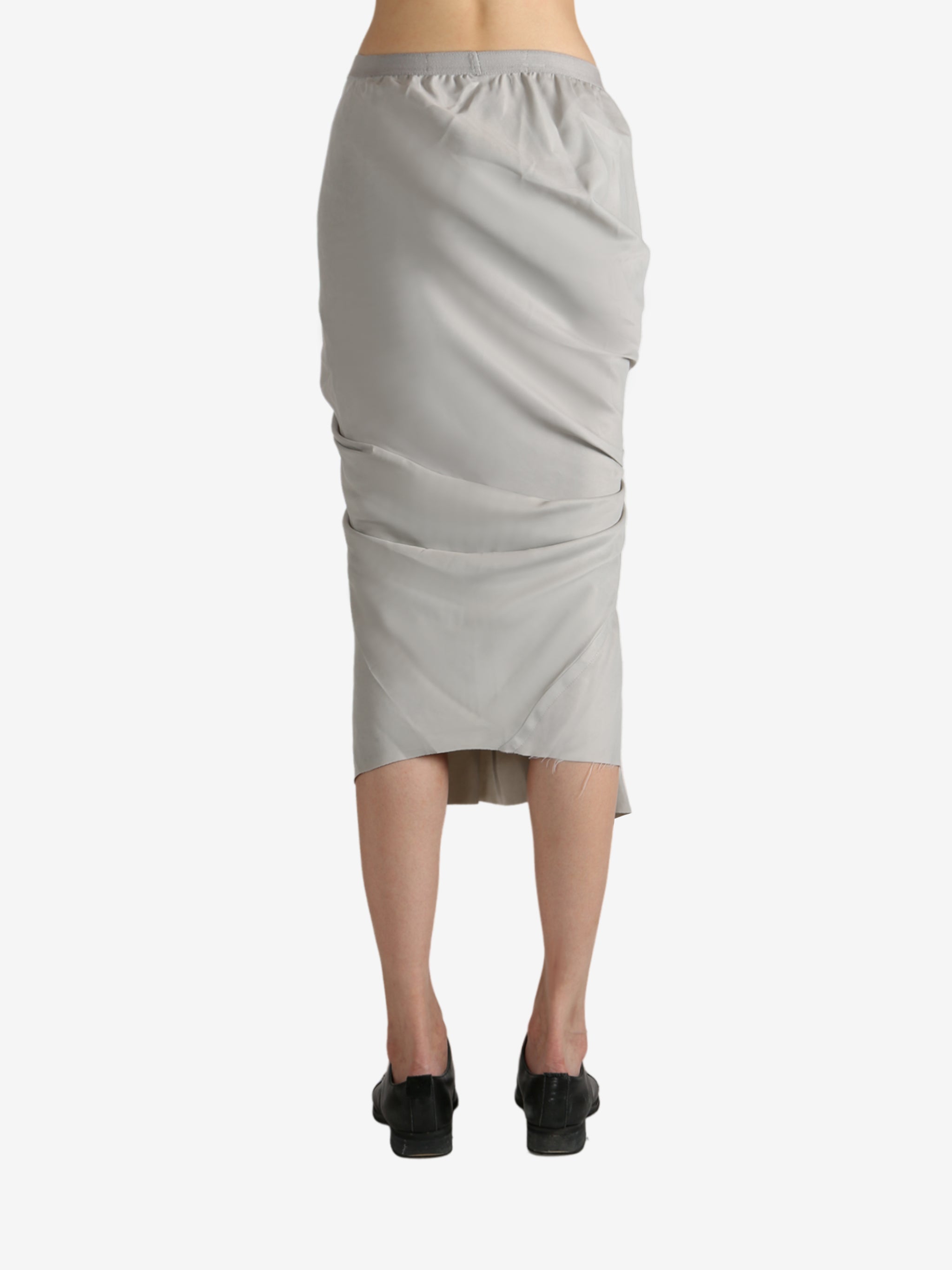 Grey skirt worn by a person, showing the skirt's fit