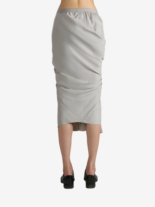 Grey skirt worn by a person, showing the skirt's fit