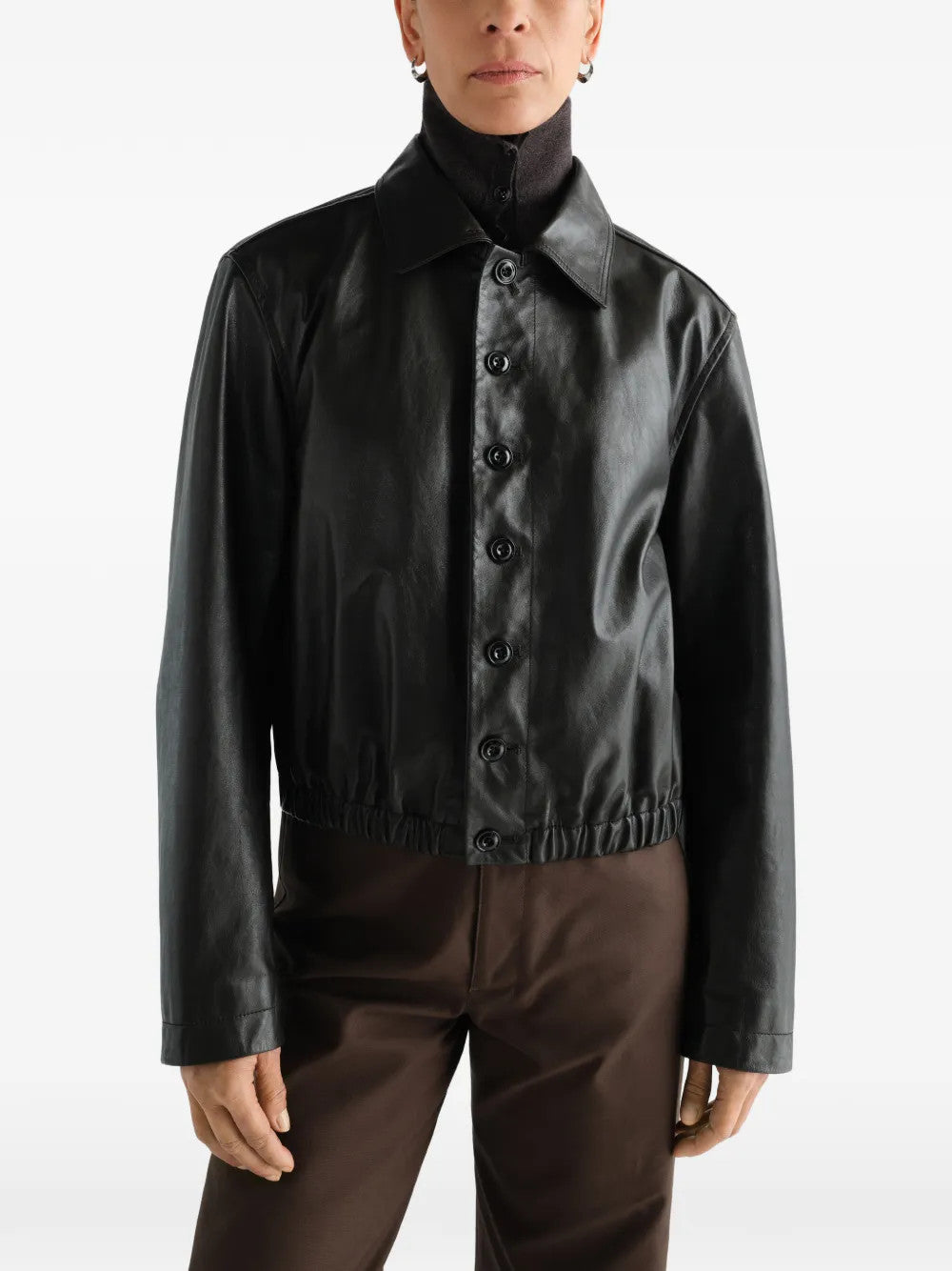 Black jacket worn by a person, showing the jacket fit