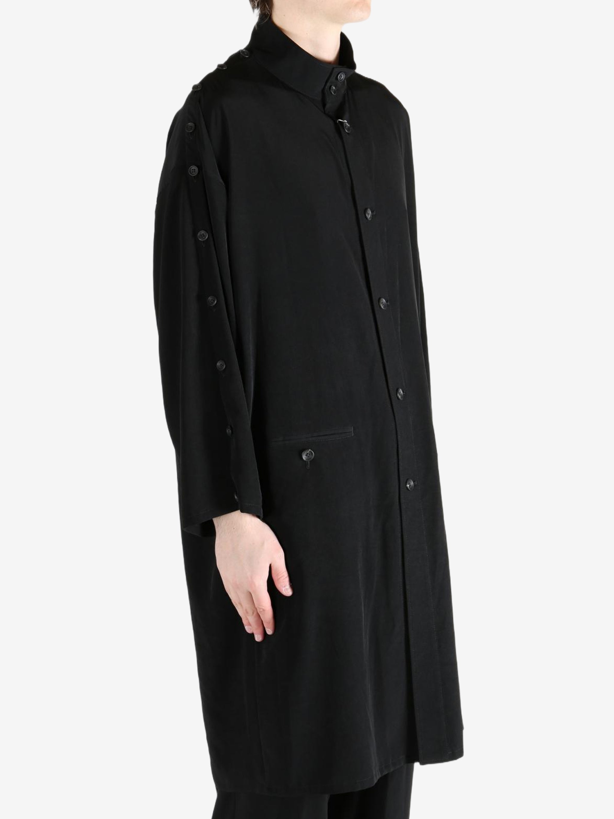 black jackets-coats worn by a person, showing the jackets-coats fit