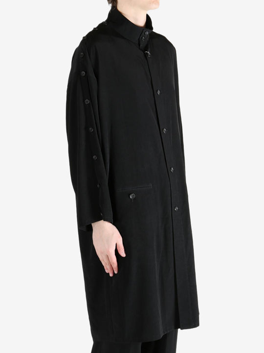 black jackets-coats worn by a person, showing the jackets-coats fit