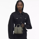 Black bag worn by a person, showing the bag's fit