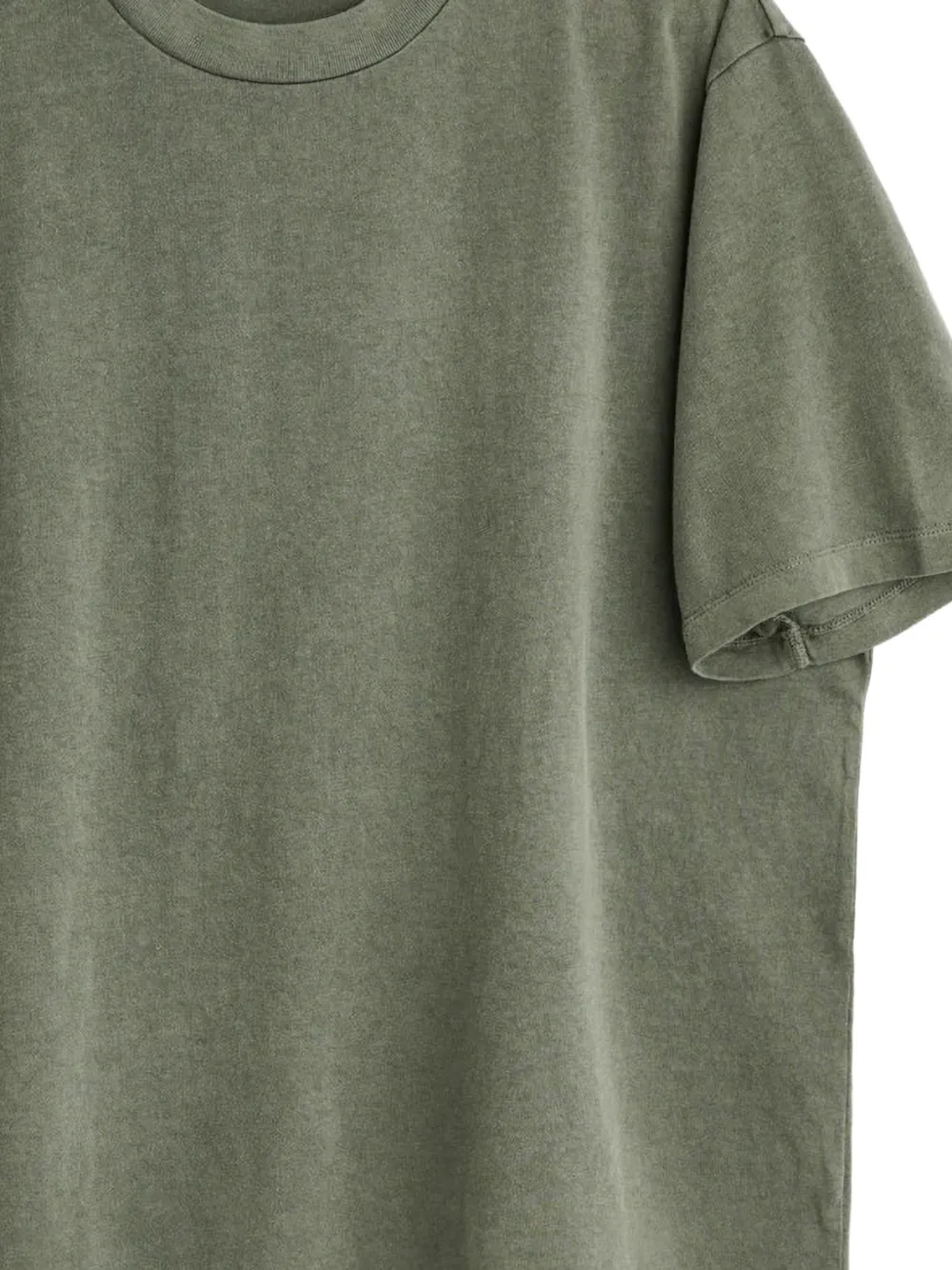 Close up of green t-shirt, showing texture of the Cotton fabric
