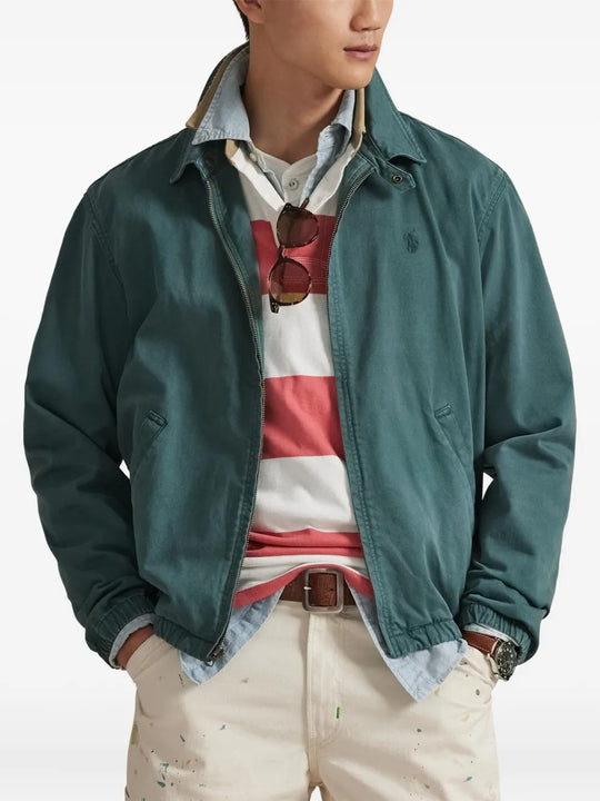 Green jacket worn by a person, showing the jacket's fit