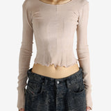 Tan top worn by a person, showing the top's fit