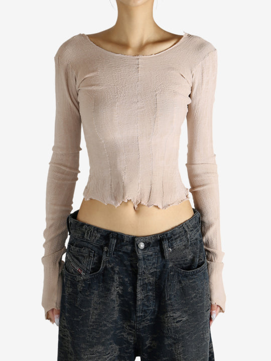 Tan top worn by a person, showing the top's fit