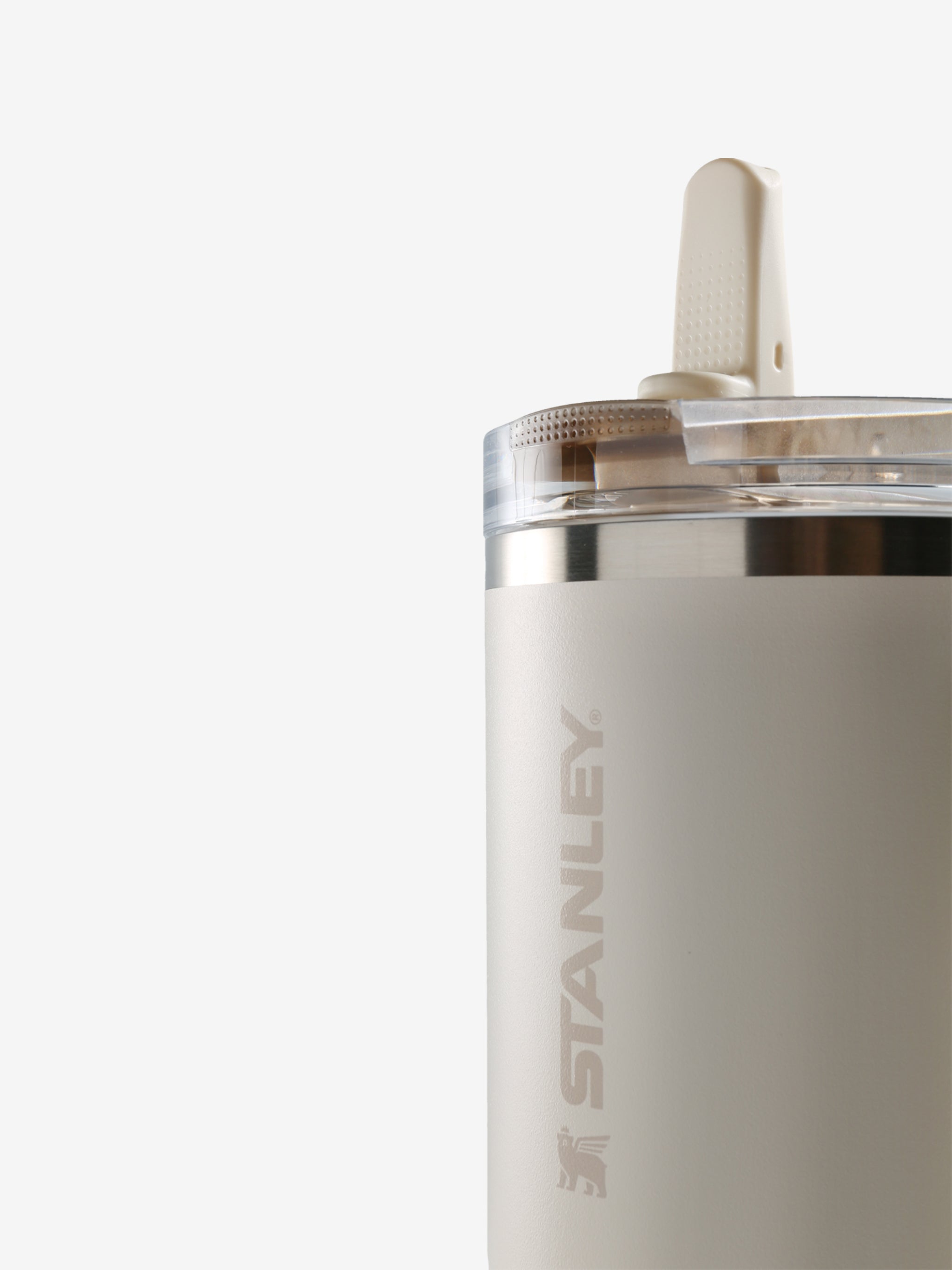 Close up of tan tumbler, showing texture of the stainless steel fabric