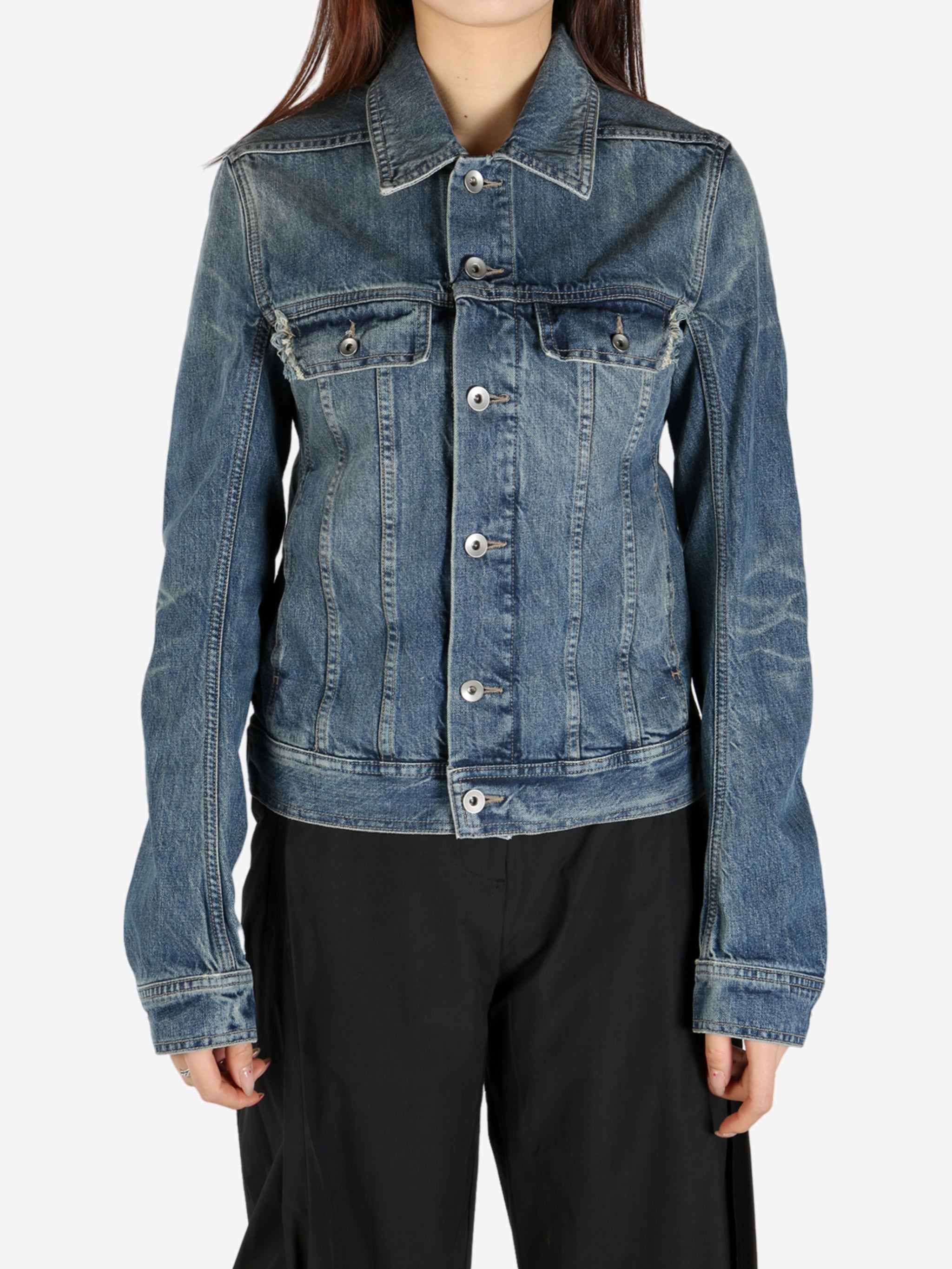 Blue jacket worn by a person, showing the jacket's fit