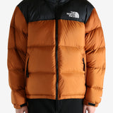 Orange jacket worn by a person, showing the jacket's fit