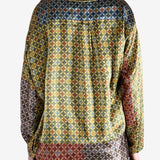 Yellow shirt worn by a person, showing the shirt's fit