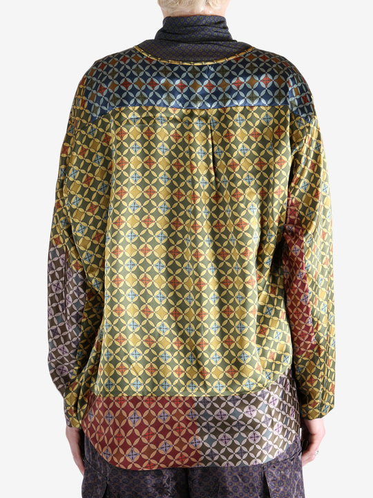 Yellow shirt worn by a person, showing the shirt's fit