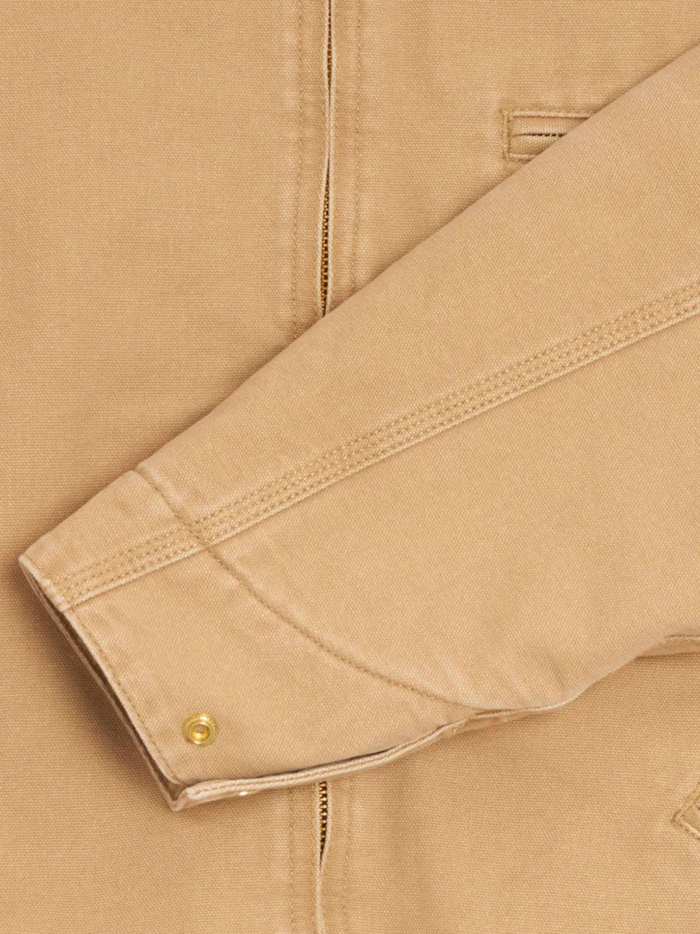 Close up of Tan jacket, showing texture of the 100% organic cotton made fabric