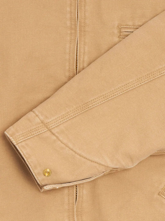 Close up of Tan jacket, showing texture of the 100% organic cotton made fabric