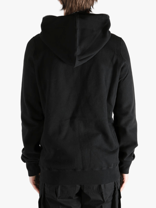 Black hoodie worn by a person, showing the hoodie fit