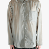 Grey shirt worn by a person, showing the shirt's fit