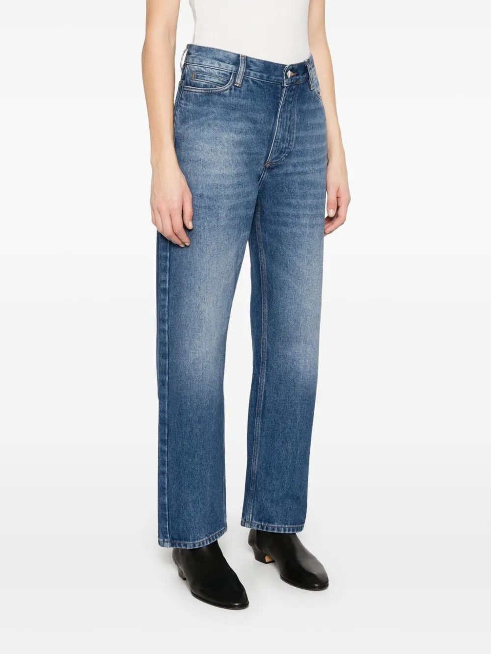 Blue jeans worn by a person, showing the jeans' fit