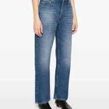 Blue jeans worn by a person, showing the jeans' fit