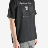 Black t-shirt worn by a person, showing the t-shirt's fit