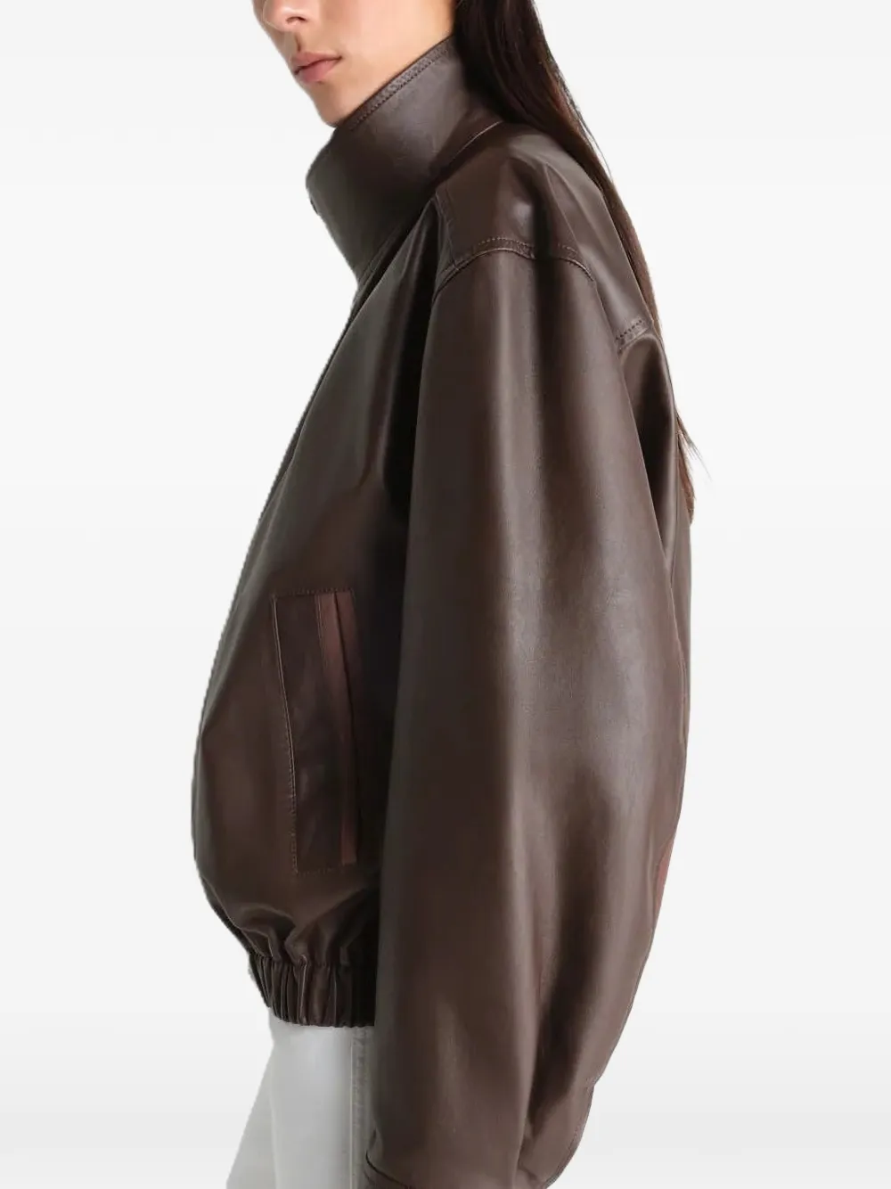 Brown jacket worn by a person, showing the oversized fit