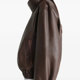 Brown jacket worn by a person, showing the oversized fit