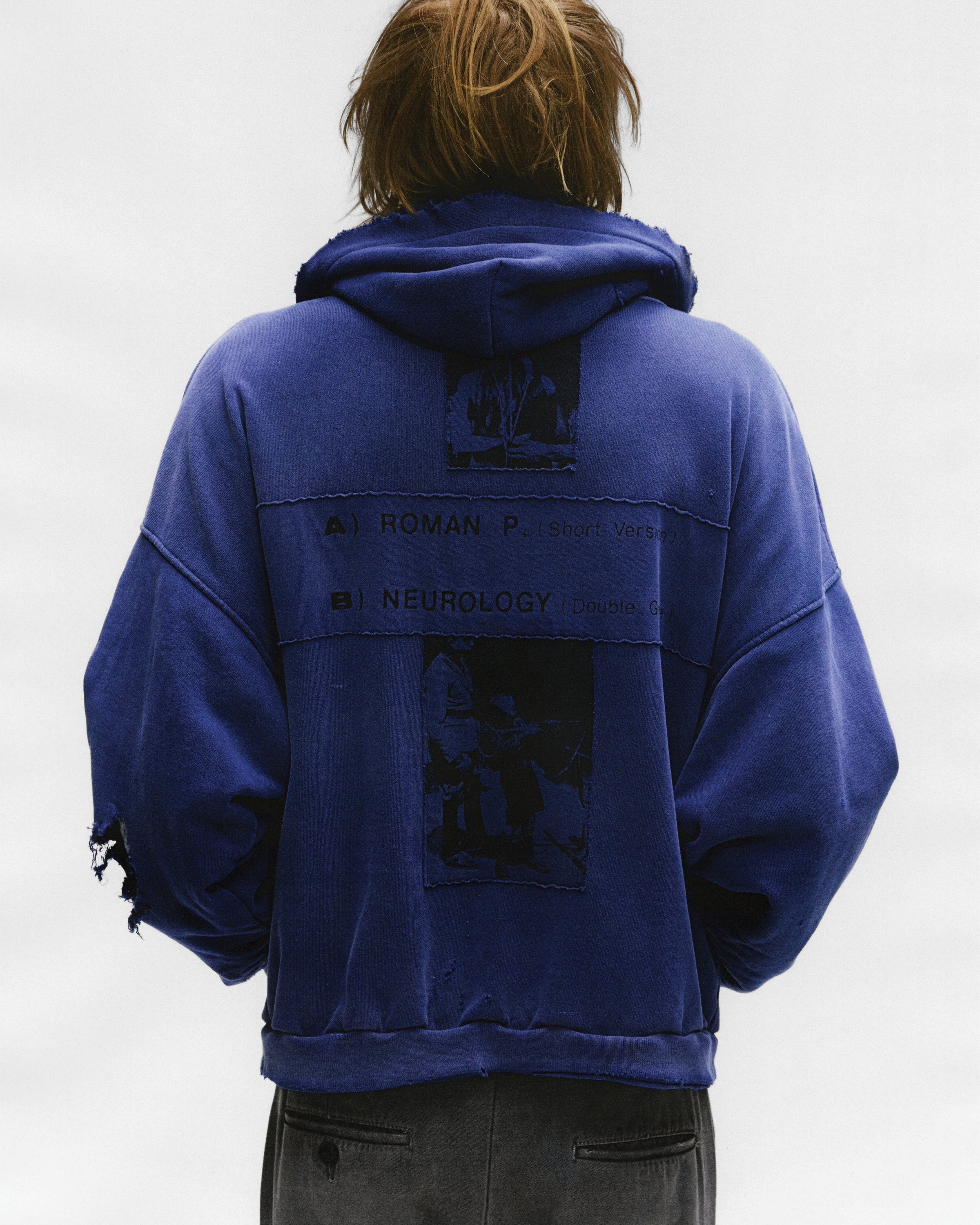 Blue hoodie worn by a person, showing the hoodie's fit