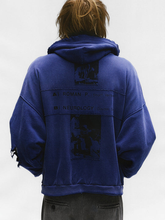 Blue hoodie worn by a person, showing the hoodie's fit