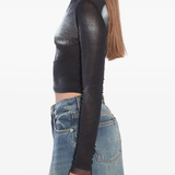 Black top worn by a person, showing the top's fit