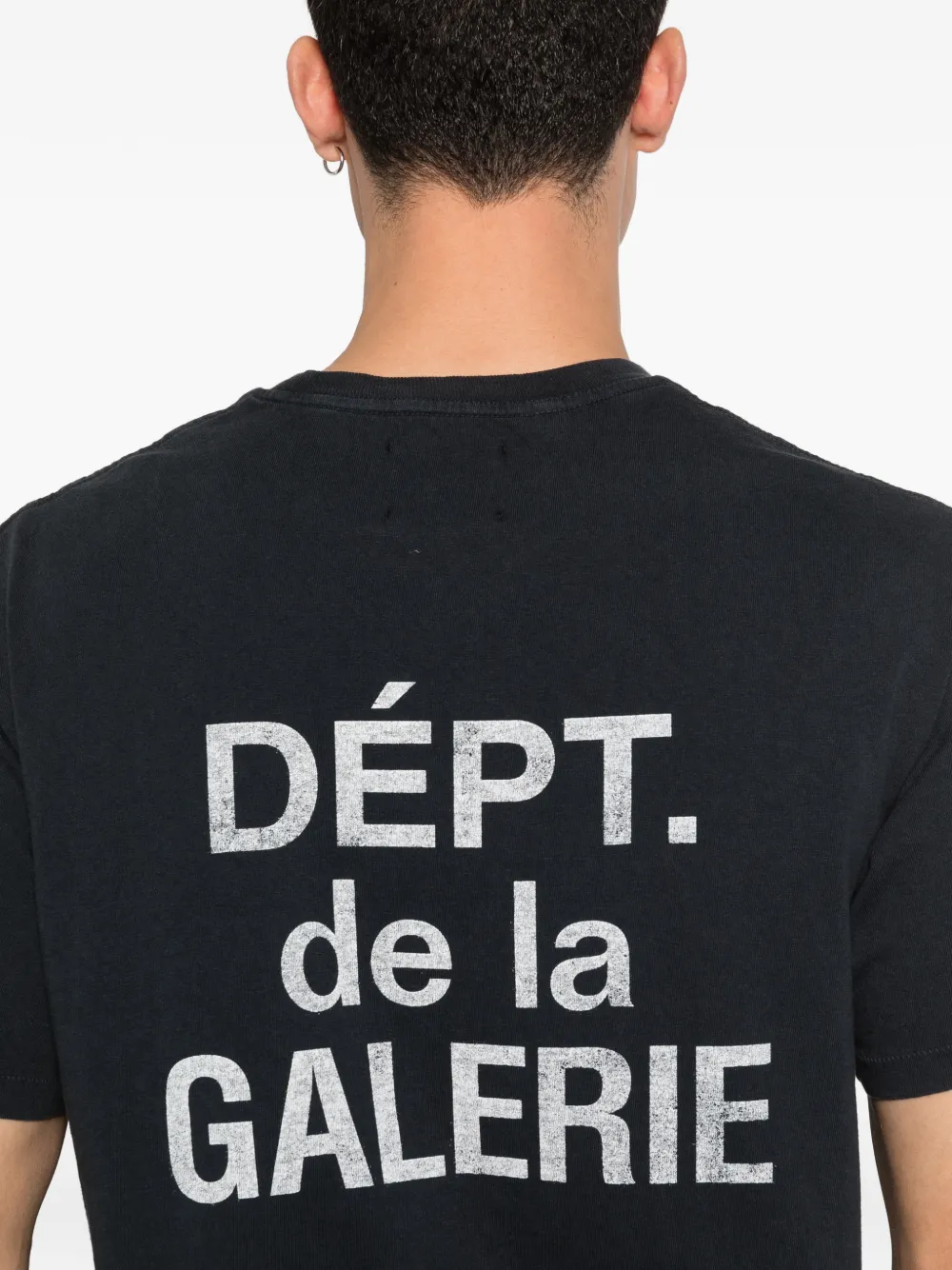 Close up of black t-shirt, showing texture of the cotton fabric