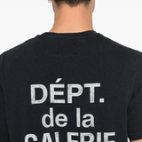 Close up of black t-shirt, showing texture of the cotton fabric