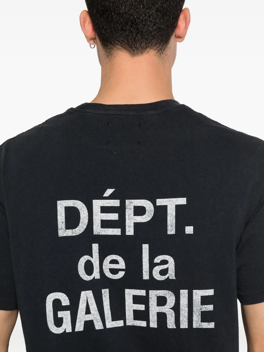 Close up of black t-shirt, showing texture of the cotton fabric
