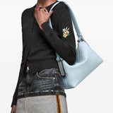 Blue bag worn by a person, showing the bag fit