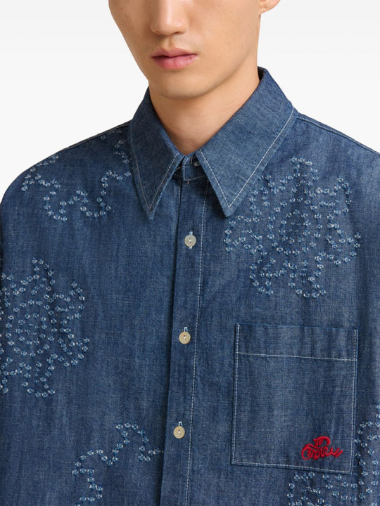 Close up of blue shirts, showing texture of the cotton fabric