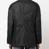 Black jacket worn by a person, showing the jacket's fit