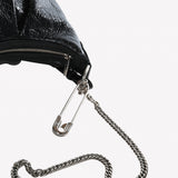 Close up of balck bag, showing the chain's detail