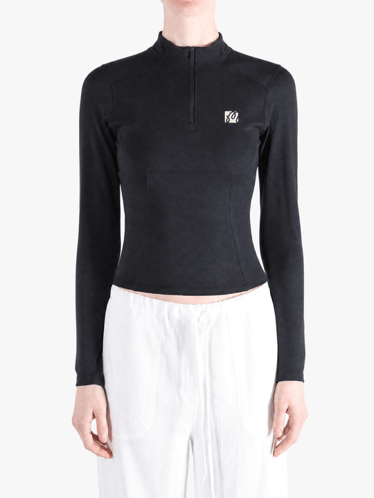 Black hoodie worn by a person, showing the hoodie fit