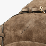 Close up of brown bag, showing texture of the calf leather fabric