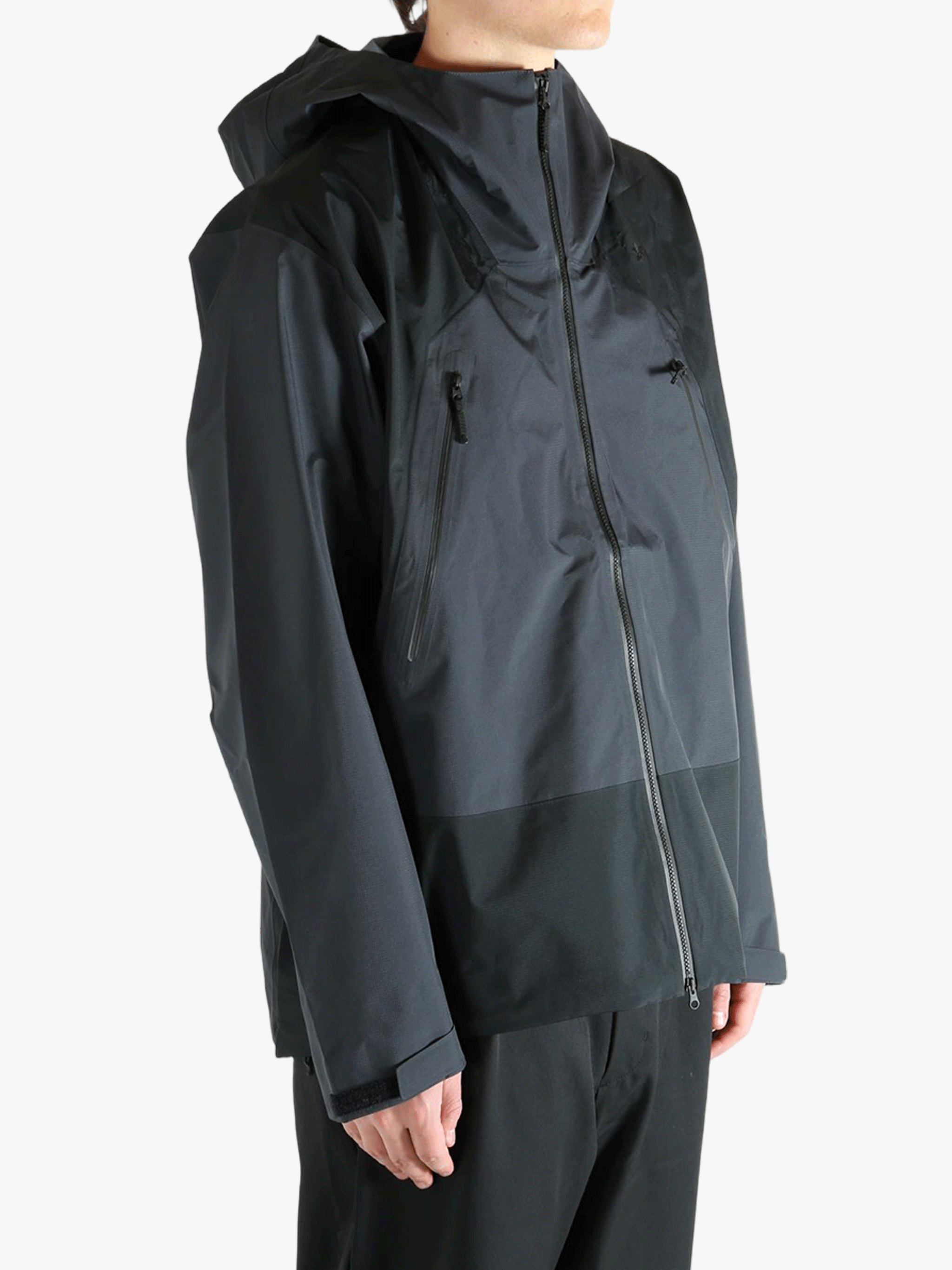 Black jacket worn by a person, showing the  jacket's fit