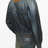 Blue coats worn by a person, showing the coats fit