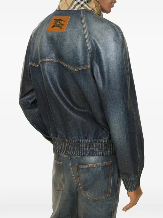 Blue coats worn by a person, showing the coats fit