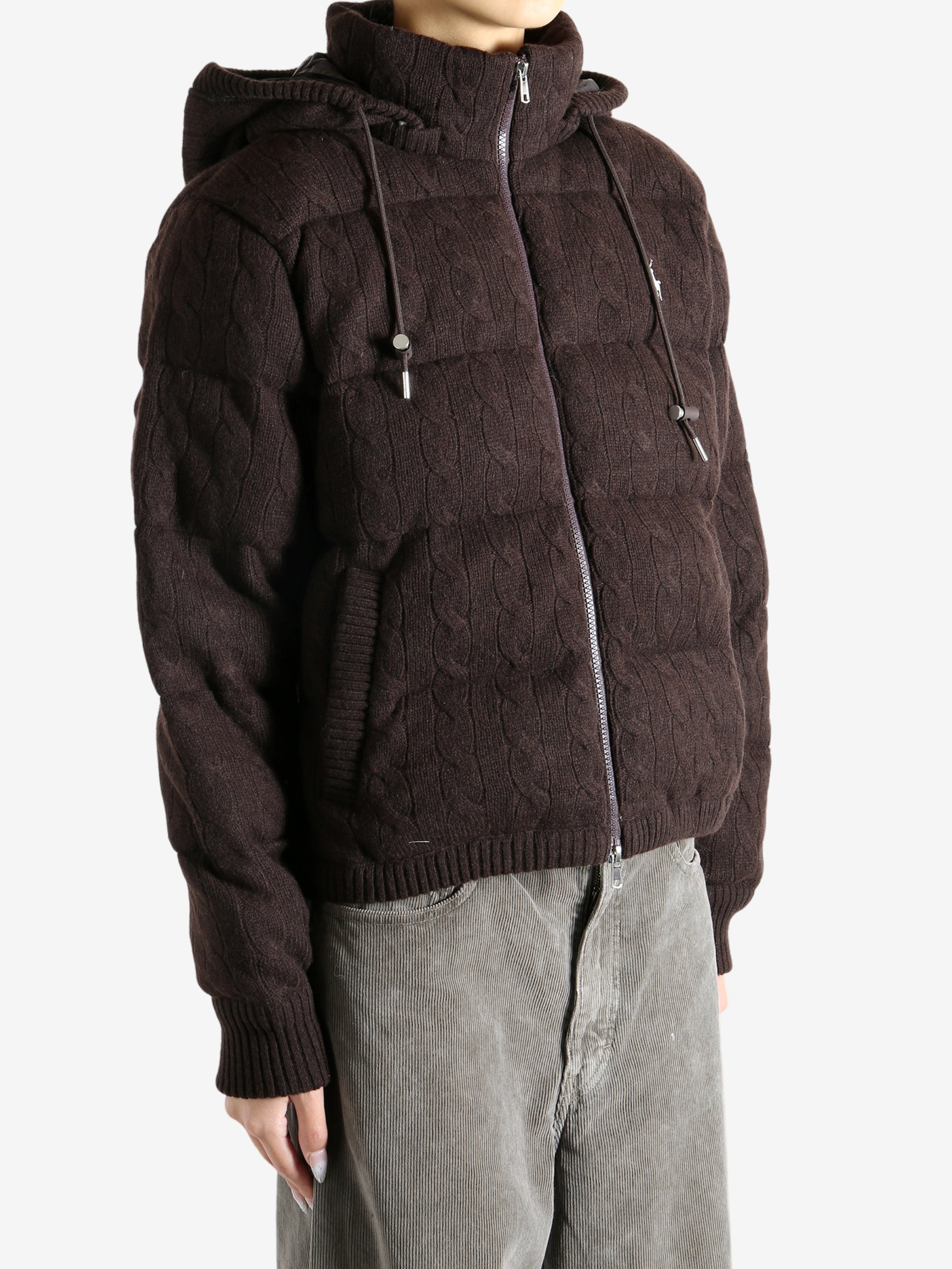 Brown coat worn by a person, showing the coat's fit