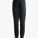 Black pants worn by a person, showing the pants' fit